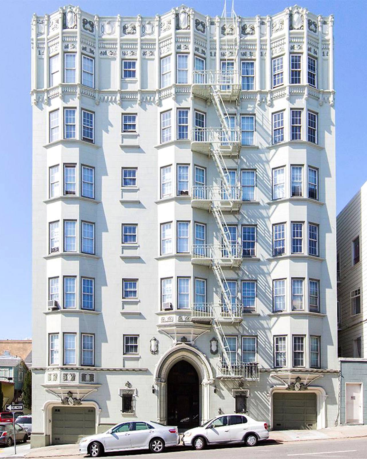 A white building with blue trim and windows.