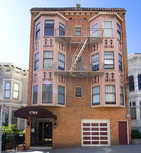 a brick apartment building with a fire escape