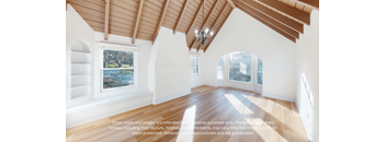 an empty living room with white walls and wood floors and a large window