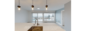 an open kitchen and living room with large windows and a sink