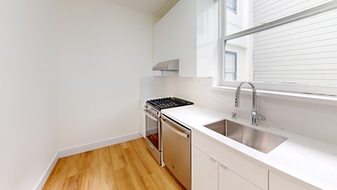 A kitchen with a dishwasher and a sink.
