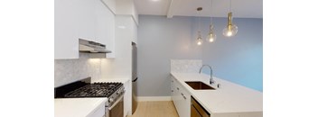 a kitchen with a stove and a sink