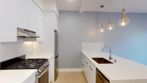 a kitchen with a stove and a sink