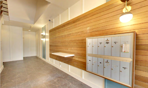 a locker room with a row of lockers and a bench