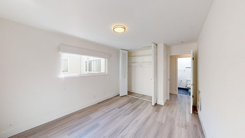 A room with a window and a door is shown.