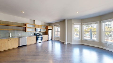 A spacious kitchen with wooden cabinets and a large island.