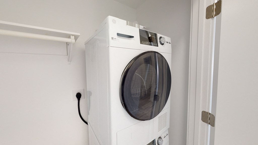 a white washer and dryer in a white room