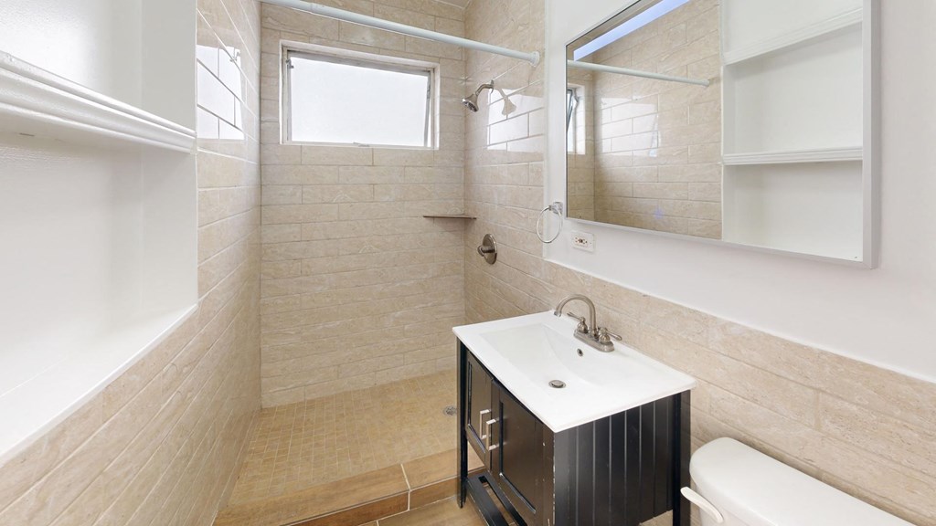 a small bathroom with a sink and a mirror