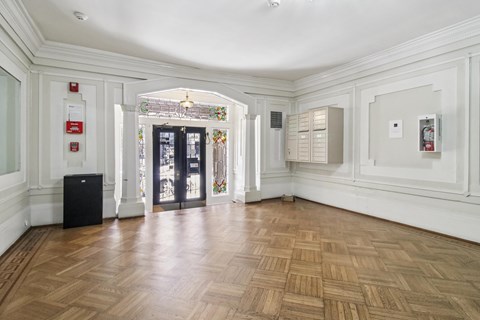 A room with wooden floors and white walls.