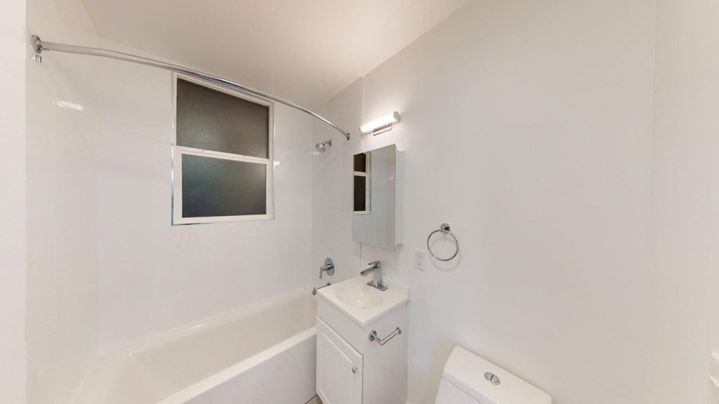 a bathroom with a sink and a bath tub