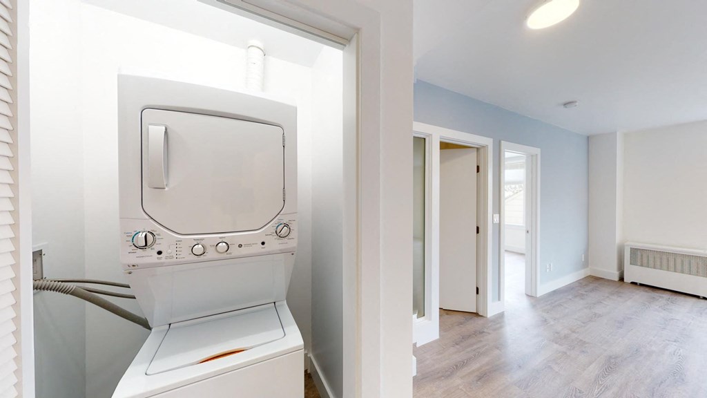 a laundry room with a washer and dryer in a house