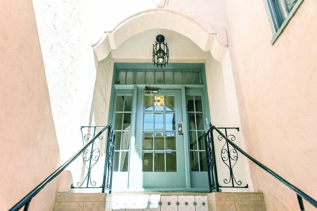 the front entrance of the apartment building.