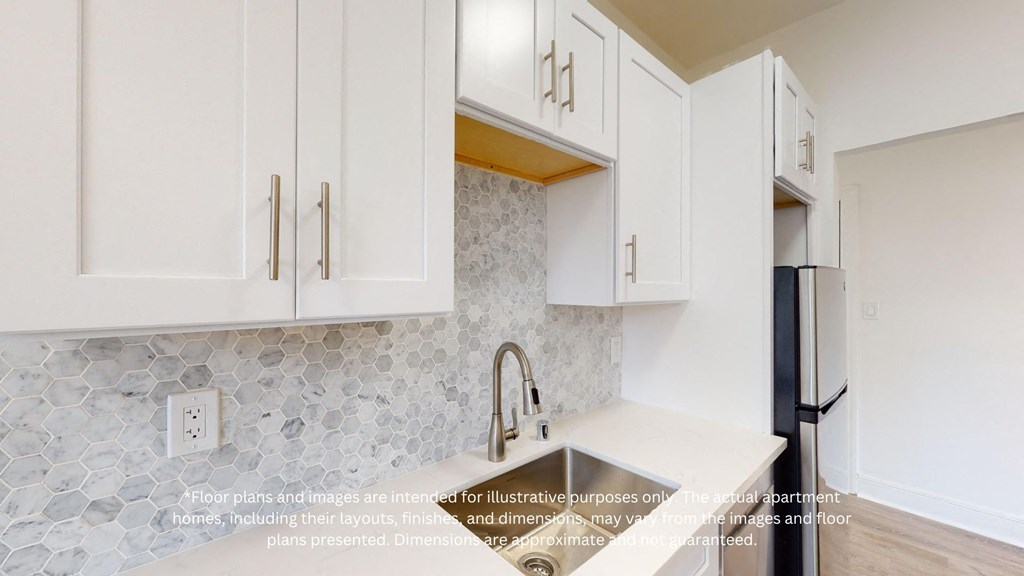an image of a kitchen with white cabinets and stainless steel appliances