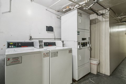 A white industrial machine with a red sticker on it.