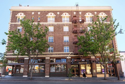 A building with a Pappy's storefront on the ground floor.