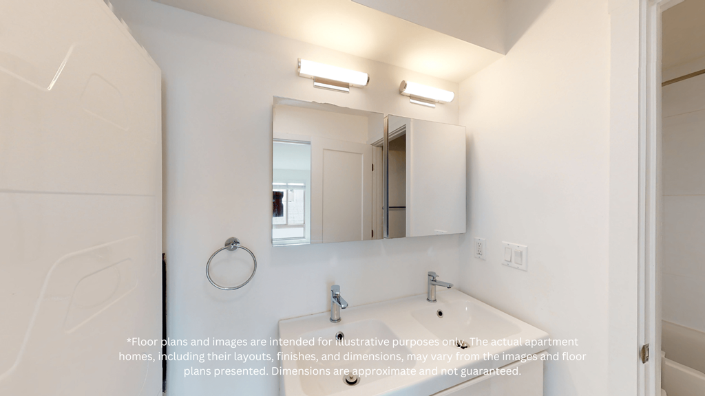 a white bathroom with a large mirror and a sink