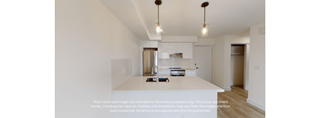 a view of a kitchen with white counter tops and a sink and