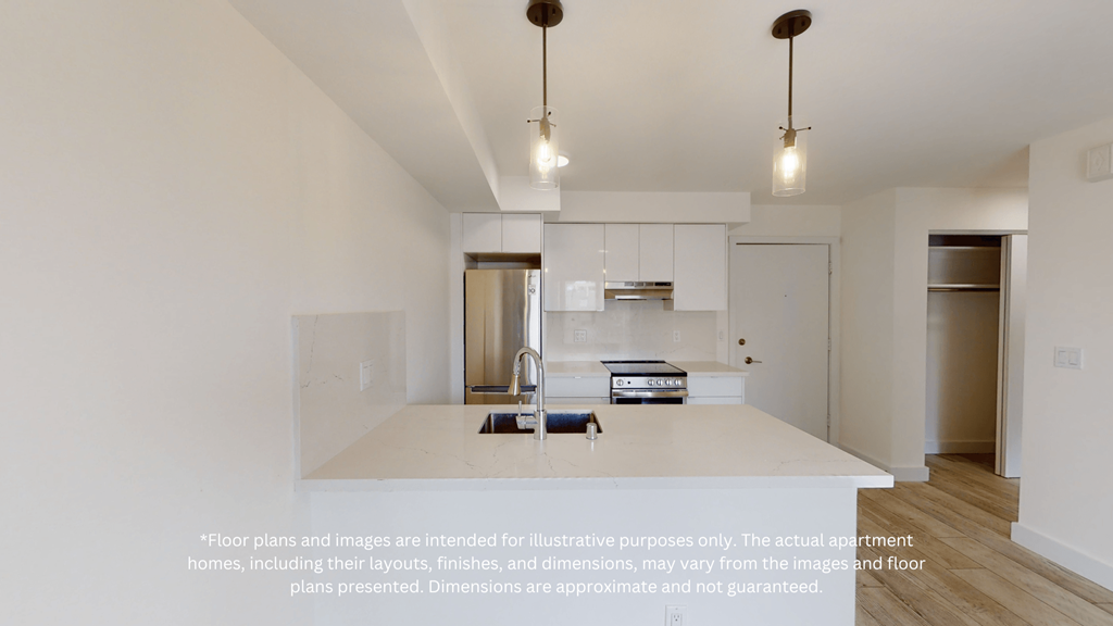 a view of a kitchen with white counter tops and a sink and