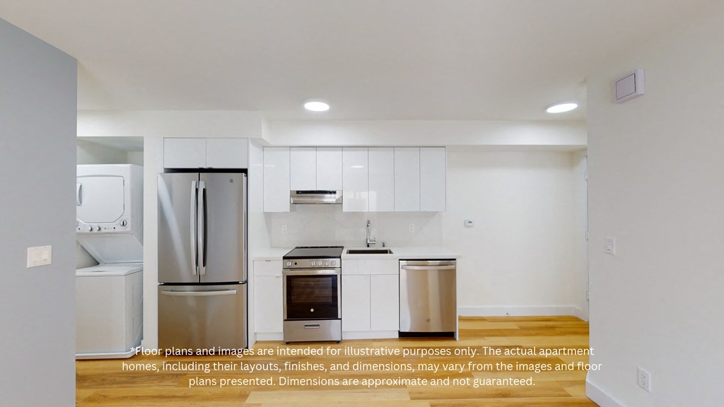 an empty kitchen with white cabinets and stainless steel appliances