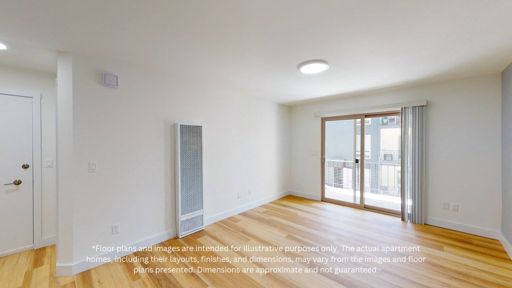 an empty living room with a door to a balcony