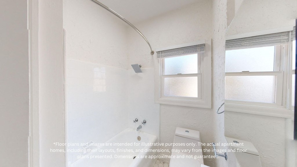 an empty bathroom with a tub and a window