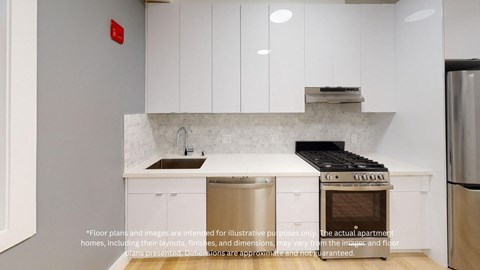 a small kitchen with white cabinets and a stainless steel stove and refrigerator