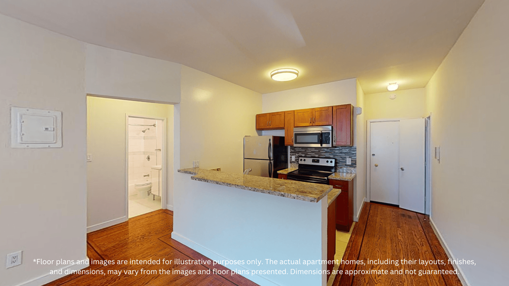 A kitchen with a counter and cabinets.