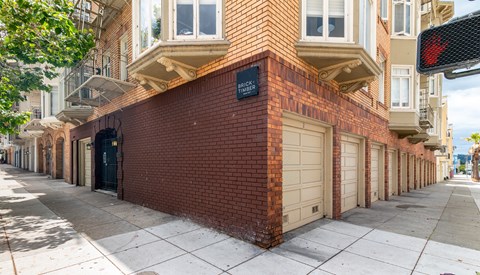 A red brick building with a sign that says "Brick Street".