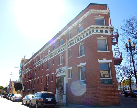 a large brick building on a city street