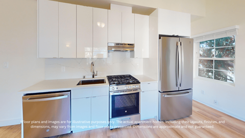A kitchen with white cabinets and stainless steel appliances.