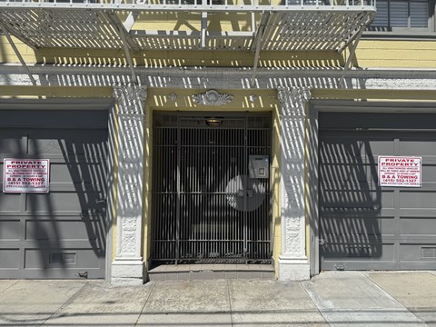 A gate with a sign that says private and towing.