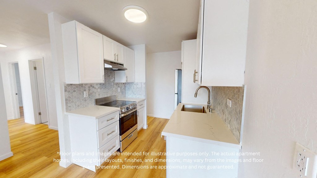 a full view of a kitchen with white cabinets and a sink