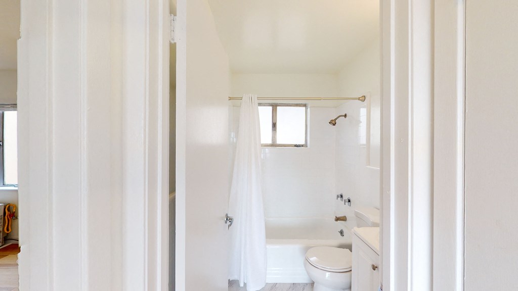 a small bathroom with a shower and a toilet