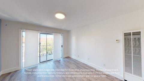 an empty living room with white walls and a sliding glass door