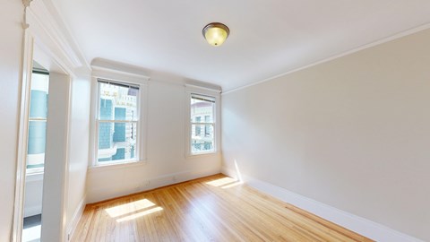 A room with wooden floors and white walls.