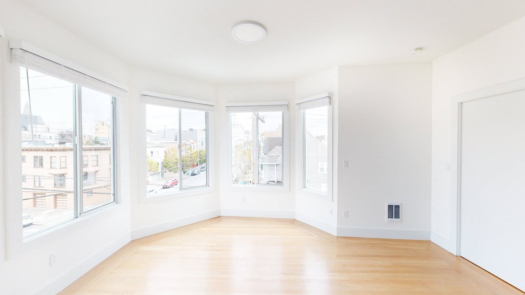 unit photo of the bedroom with large windows for natural light