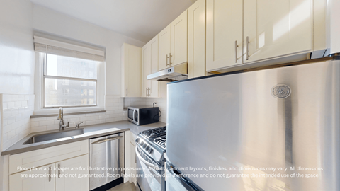 A modern kitchen with a stainless steel refrigerator, sink, and cabinets.