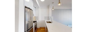 a tasting room with white walls and white counter tops with wine glasses