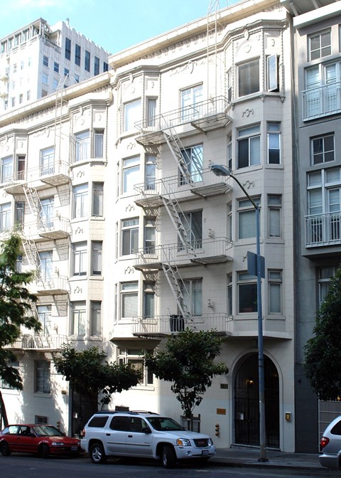 the apartment building as seen from the street