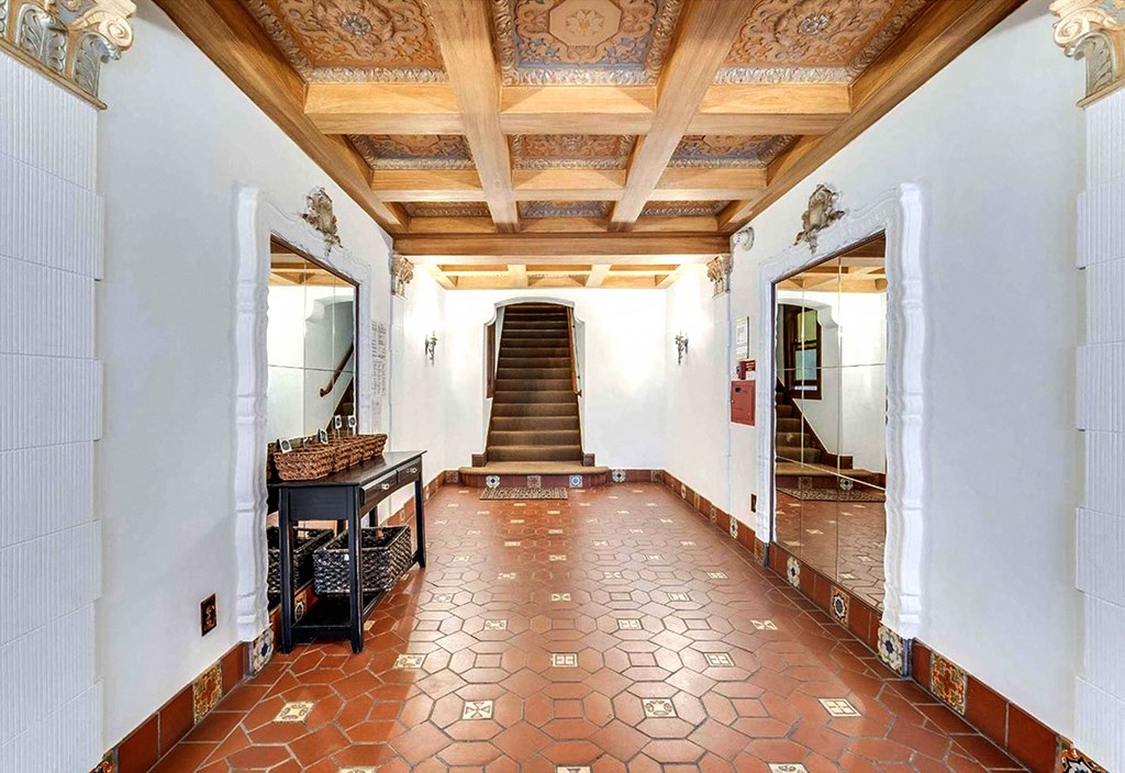 Hallway with a staircase with a wooden banister