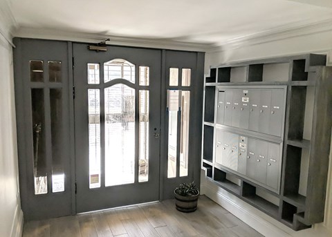 a living room and white walls and a wooden floor