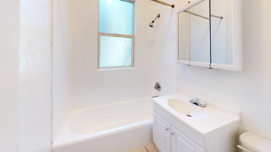 a bathroom with a sink and a bath tub