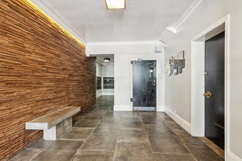 Hallway with a wooden wall and a bench