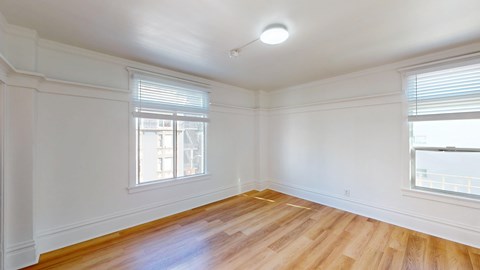 A room with wooden floors and white walls.