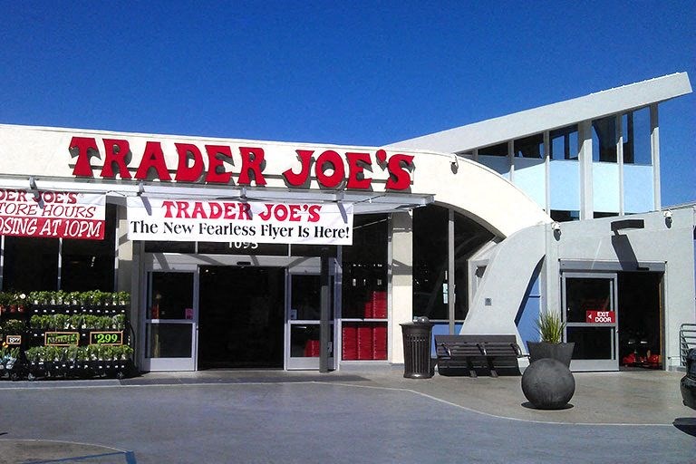 a trader joes trader joes store with a blue sky