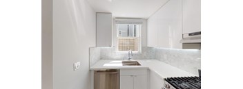 a kitchen with a sink and a window