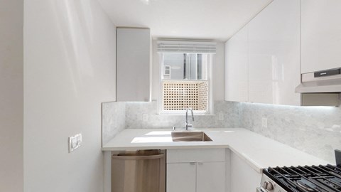 a kitchen with a sink and a window