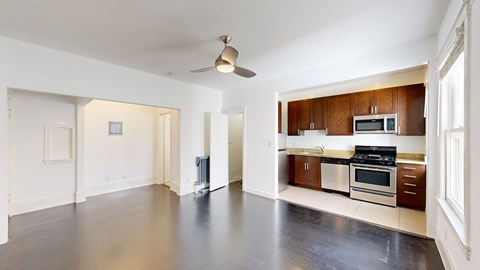 A spacious kitchen with a microwave, oven, and stove top.