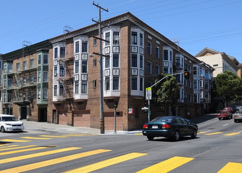 a brick building on the corner of a city street