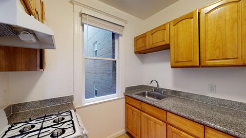 a kitchen with a sink and a window